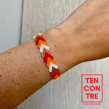 Load image into Gallery viewer, Miyuki bracelet with sliding knot on the back in red and orange tones